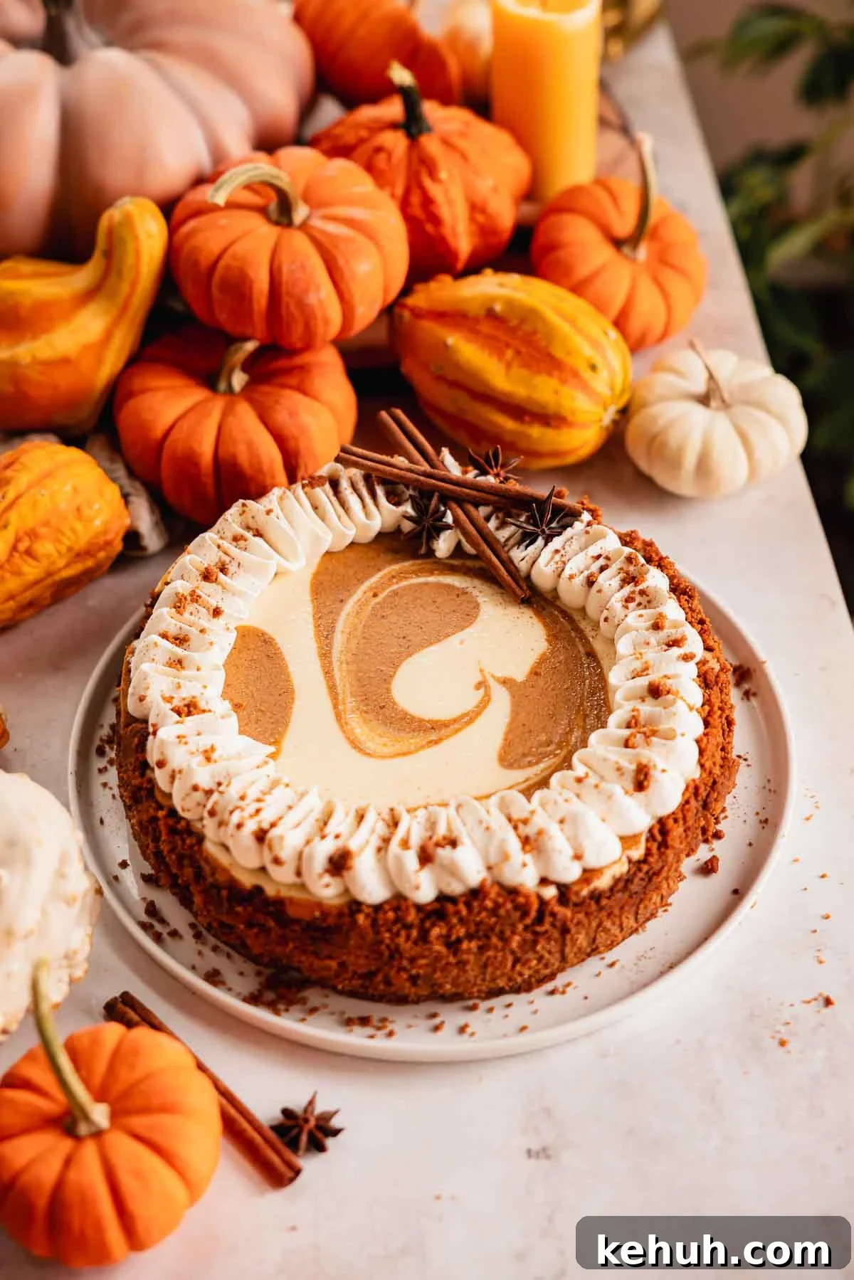 Pumpkin Swirl Cheesecake Recipe: Creamy Autumn Dessert 2 pumpkin pie cheesecake on a plate with whipped cream and swirls
