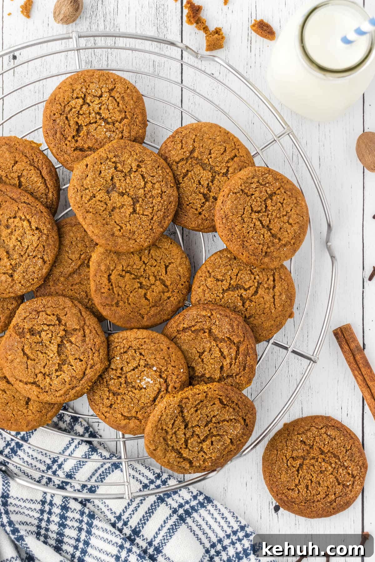 Chewy Molasses Crinkle Cookies Recipe 2 A pile of old fashioned molasses cookies on a cooling rack.