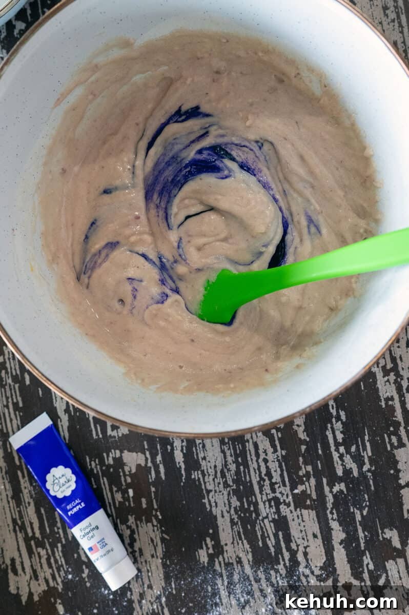 Ube Waffles Recipe: Crispy Purple Filipino Waffles 6 Adding food gel to ube waffle batter.