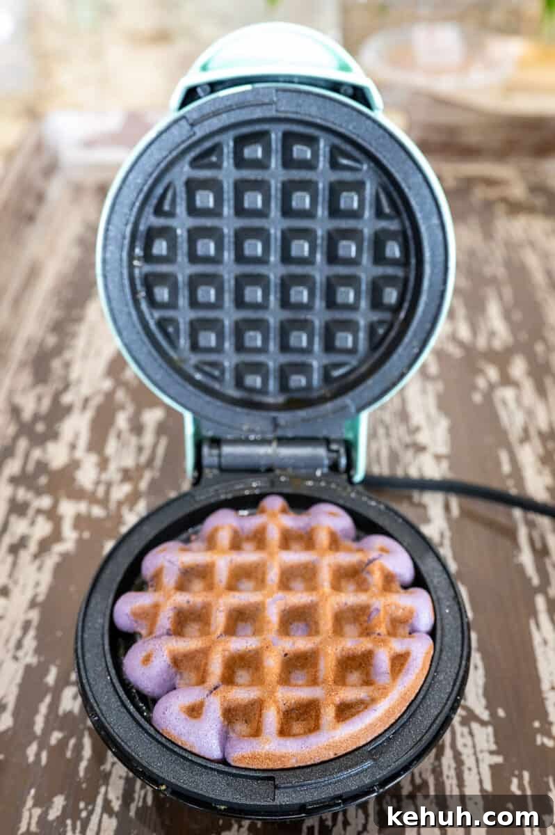 Ube Waffles Recipe: Crispy Purple Filipino Waffles 9 Cooked ube waffle on waffle maker.