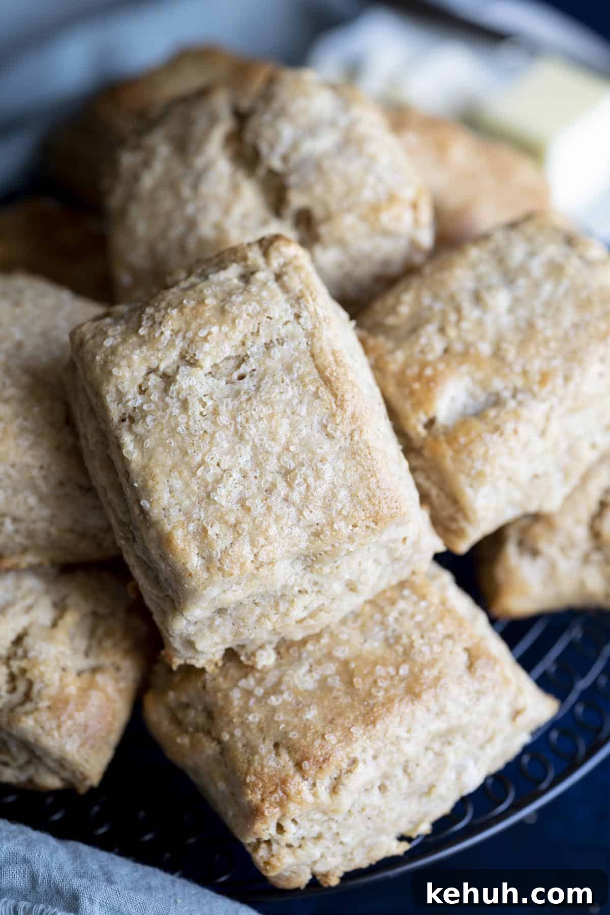 Honey Whole Wheat Biscuits A pile of whole wheat biscuits on a wire rack.
