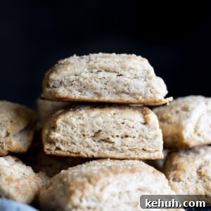 Flaky Whole Wheat Biscuits with Honey Butter Recipe 2 A stack of whole wheat biscuits on a wire rack.