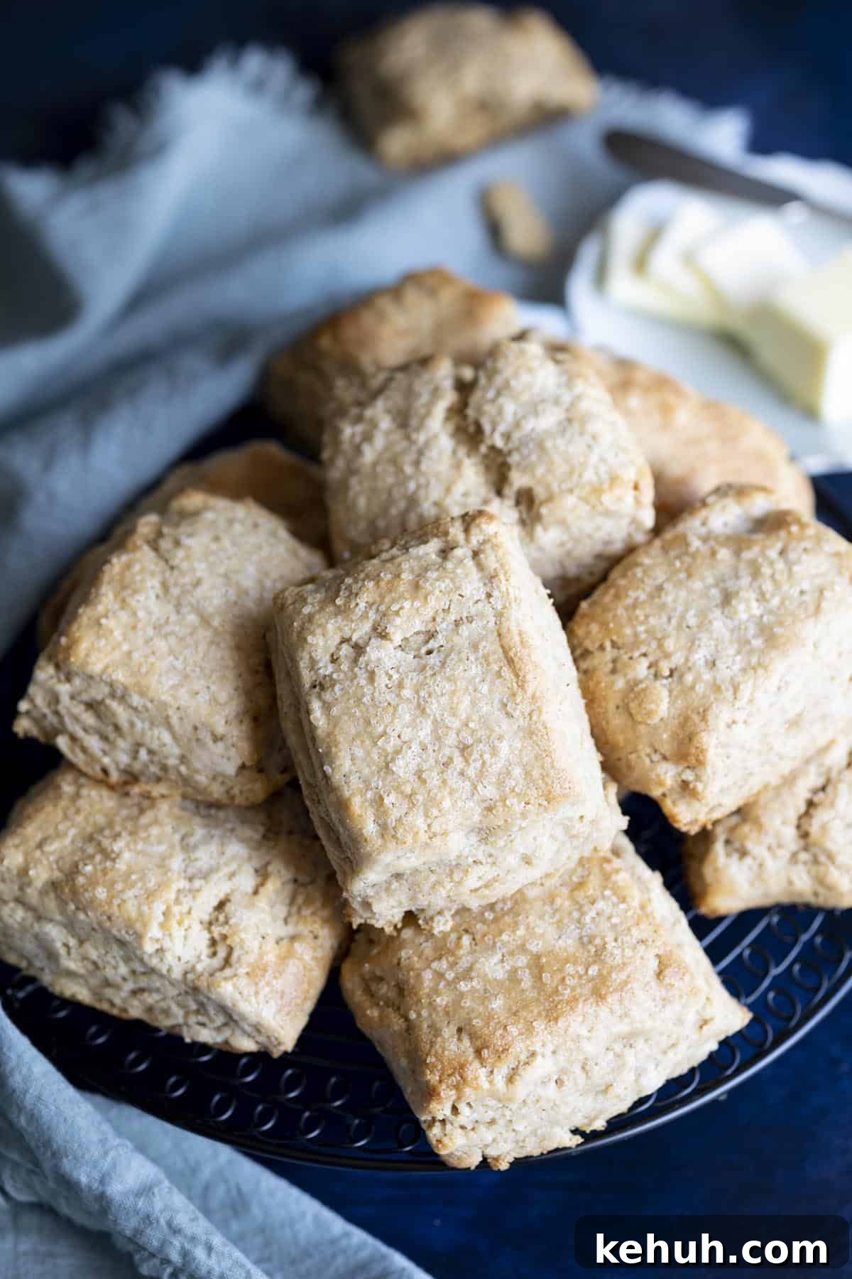 Honey Whole Wheat Biscuits A pile of whole wheat biscuits on a wire rack.