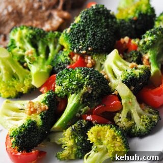 Sautéed Broccoli with Red Bell Pepper Recipe for Quick Sides 13 Cooked broccoli and red pepper on plate ready to eat.