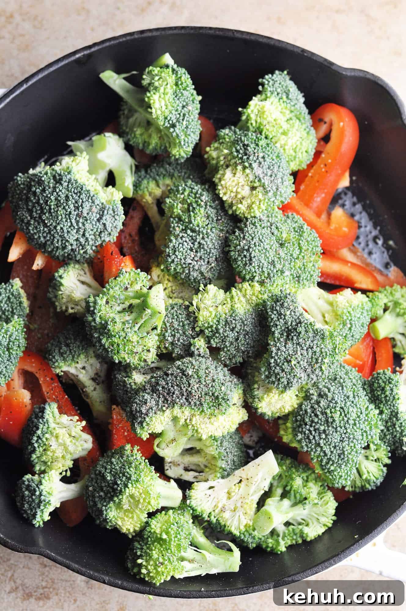 Sautéed Broccoli with Red Bell Pepper Recipe for Quick Sides 6 Broccoli and red peppers in cast iron skillet ready to cook.