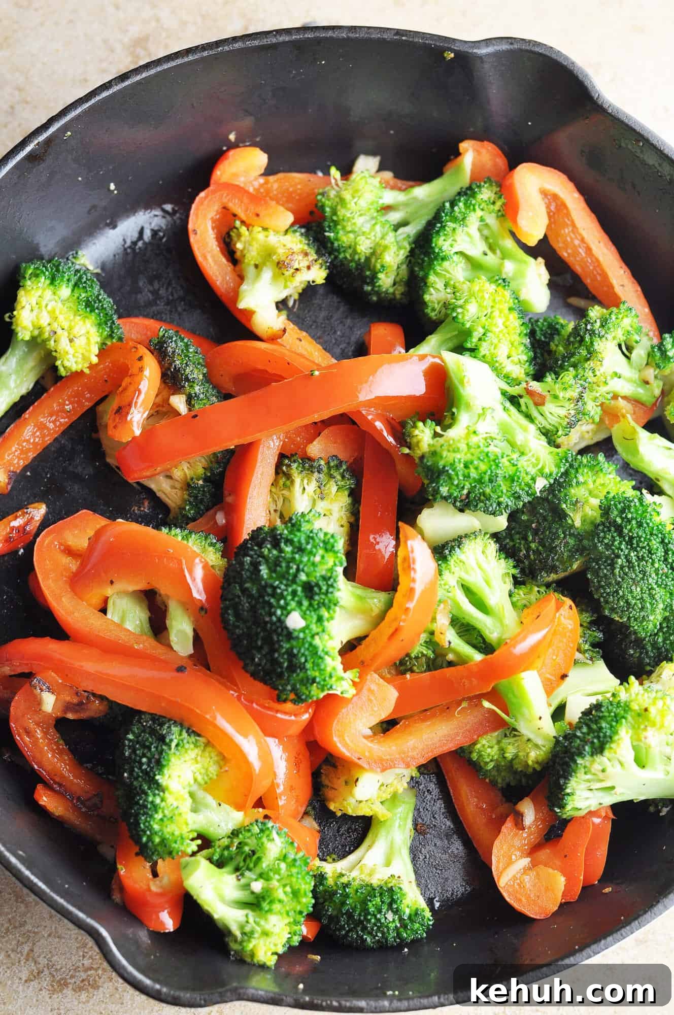 Sautéed Broccoli with Red Bell Pepper Recipe for Quick Sides 7 Cooked broccoli with red peppers and garlic in cast iron skillet.