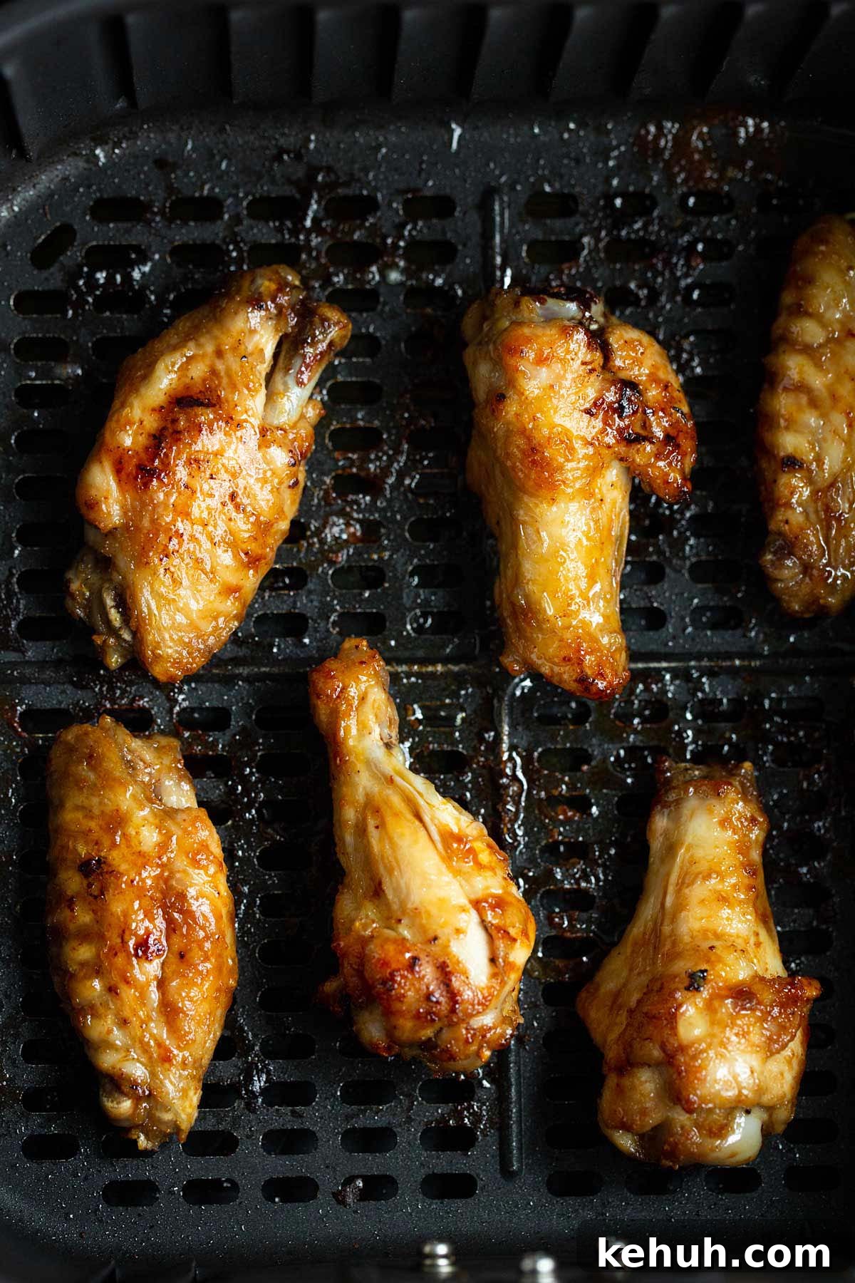 Cooked chicken wings in air fryer.