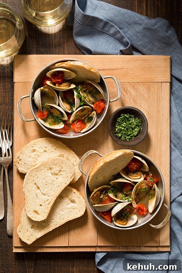 Learn how to make Steamed Clams with Pan Roasted Tomatoes as an easy date night appetizer to make at home! This recipe makes enough to serve two people, ideal for Valentine’s Day, anniversaries, birthdays, and days off together.