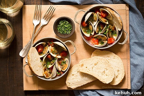 Learn how to make Steamed Clams with Pan Roasted Tomatoes as an easy date night appetizer to make at home! This recipe makes enough to serve two people, ideal for Valentine’s Day, anniversaries, birthdays, and days off together.
