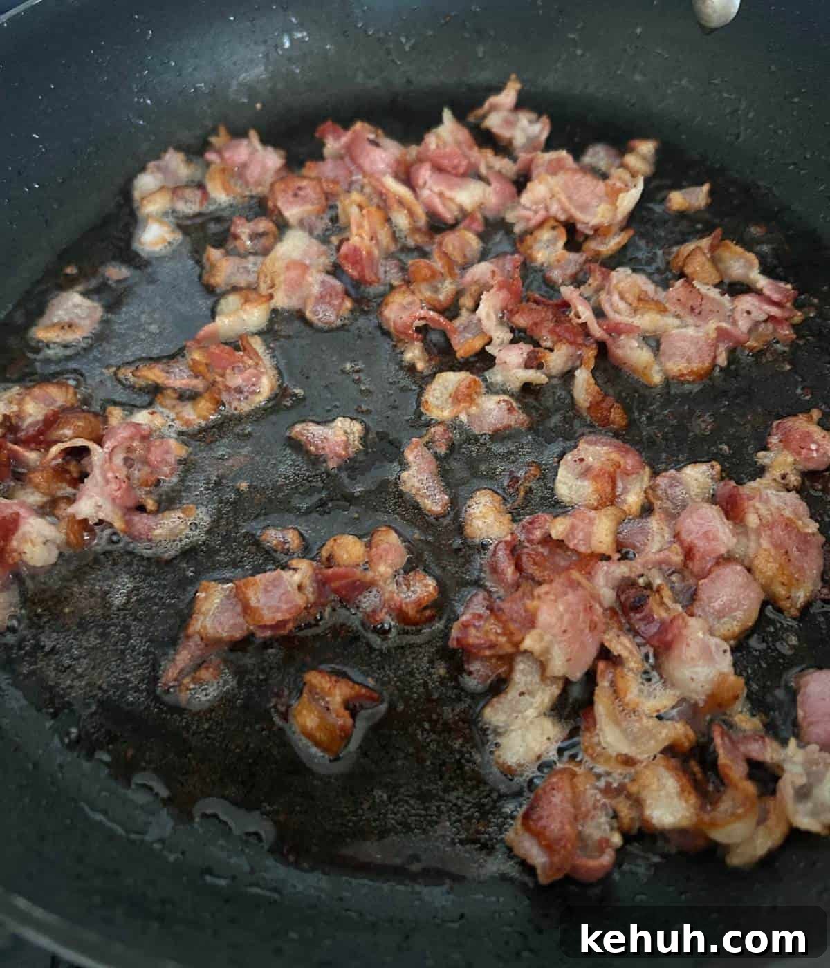 Cheesy Bacon Muffins: Savory Breakfast & Snack Recipe 4 Crispy bacon in skillet.
