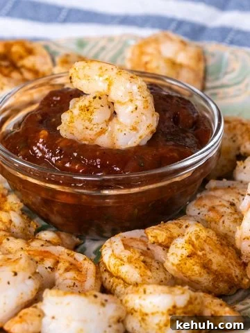 Shrimp Cocktail dipped in cocktail sauce