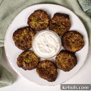 Crispy Air Fryer Zucchini Fritters Recipe 15 Air fryer zucchini fritters on a plate with aioli.