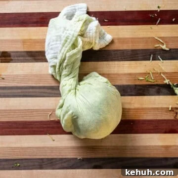 Crispy Air Fryer Zucchini Fritters Recipe 5 Grated zucchini in a cheese cloth.