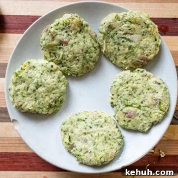 Crispy Air Fryer Zucchini Fritters Recipe 8 Zucchini mixture made into patties.