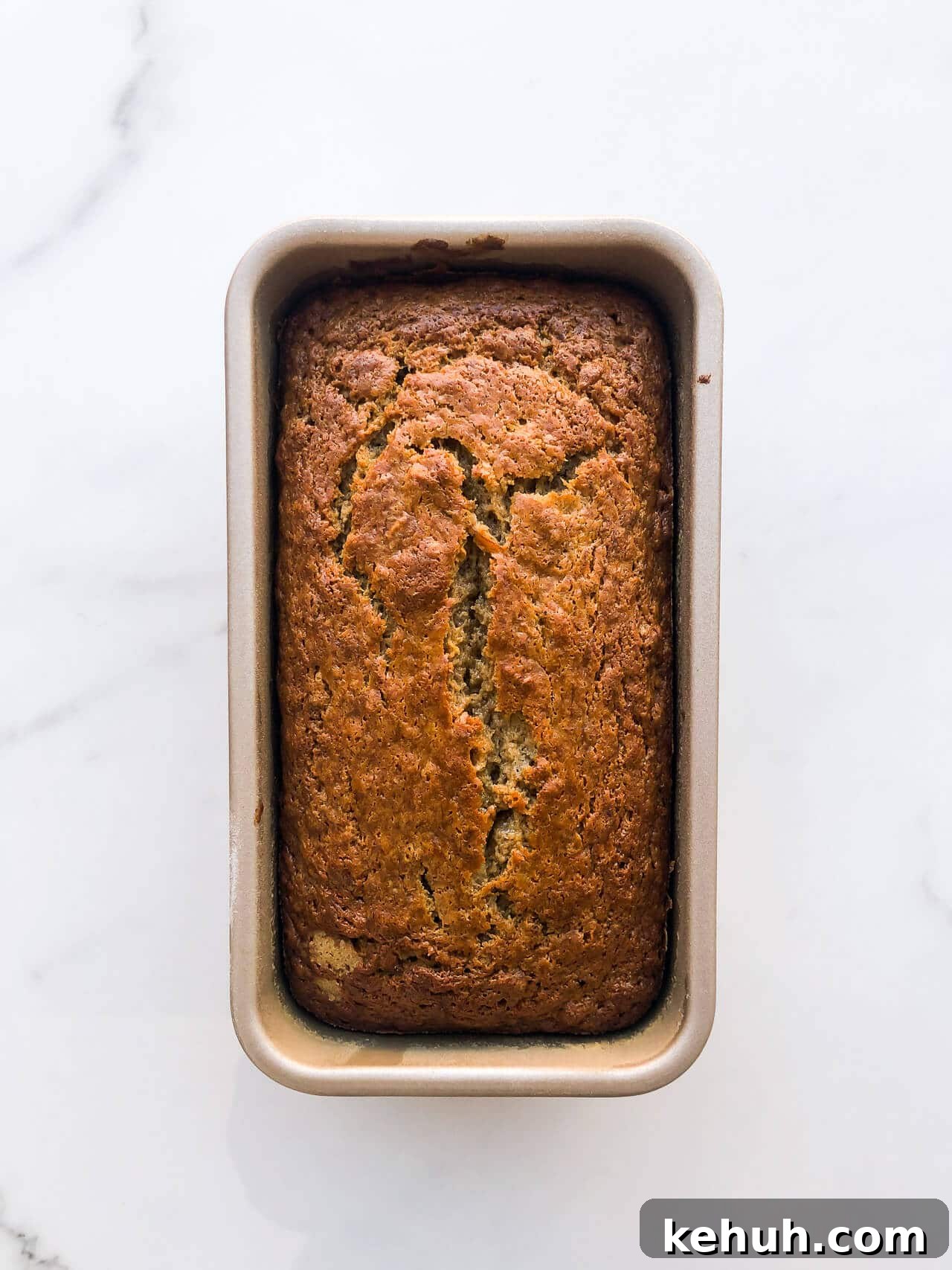Complete Guide to Baking Pans and Bakeware Types 10 Baked golden brown banana bread in a loaf cake pan