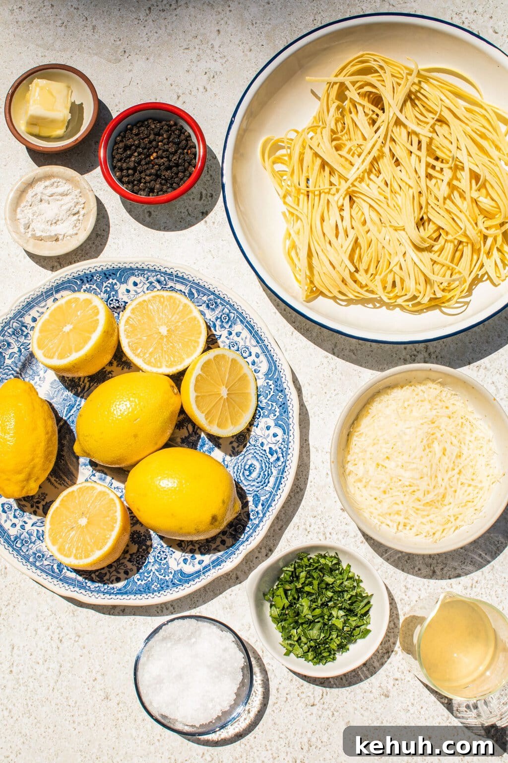 parmesan, lemons, lemon juice, salt, pasta, black pepper, chicken broth, zest, heavy whipping cream, and flour