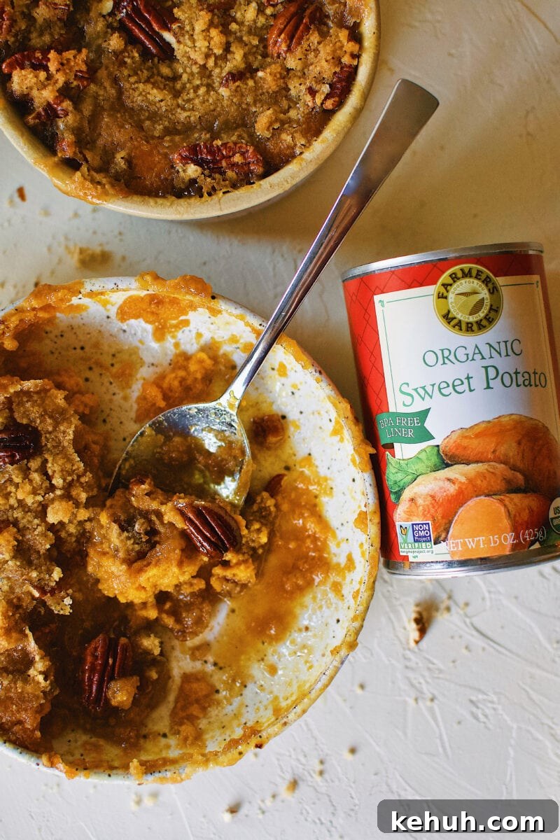 Great-Aunt Sally’s Classic Sweet Potato Soufflé Recipe 2 Great Aunt Sally's Sweet Potato Soufflé right out of the oven with a can of Farmers Market Foods Sweet Potato puree next to it.