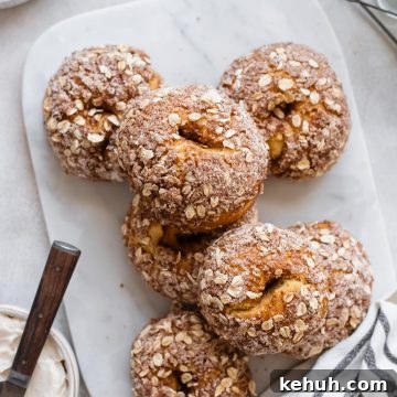 Pumpkin Spice Bagels Recipe: Homemade Fall Bagels with Warm Spices 11 bagels stacked on marble tray