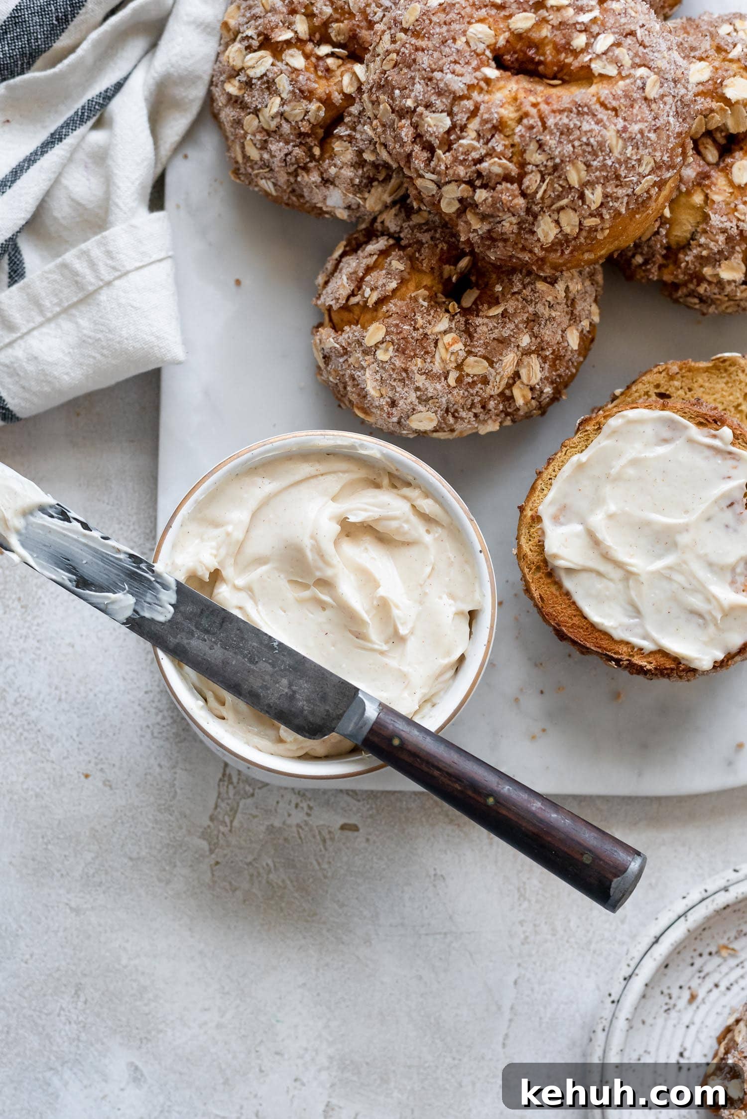 Pumpkin Spice Bagels Recipe: Homemade Fall Bagels with Warm Spices 5 close up spiced cream cheese next to pumpkin bagels