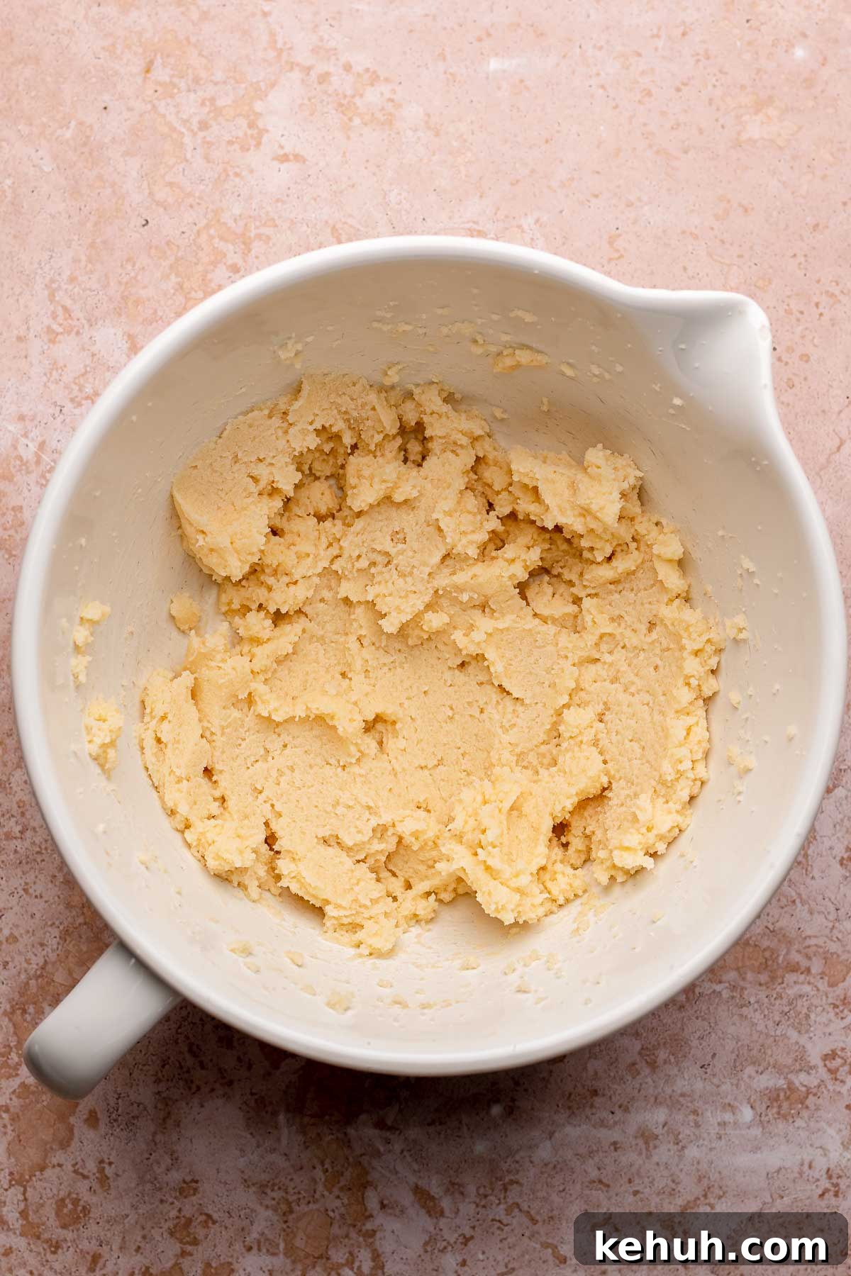 Creamed butter and sugar in a bowl.