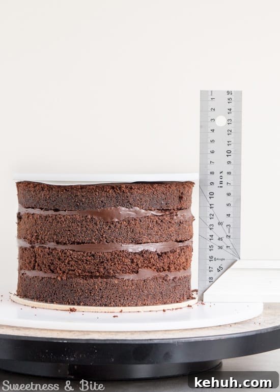 How to Cover a Cake with Smooth Ganache Finish 9 The filled cake layers with the ganache board on top.