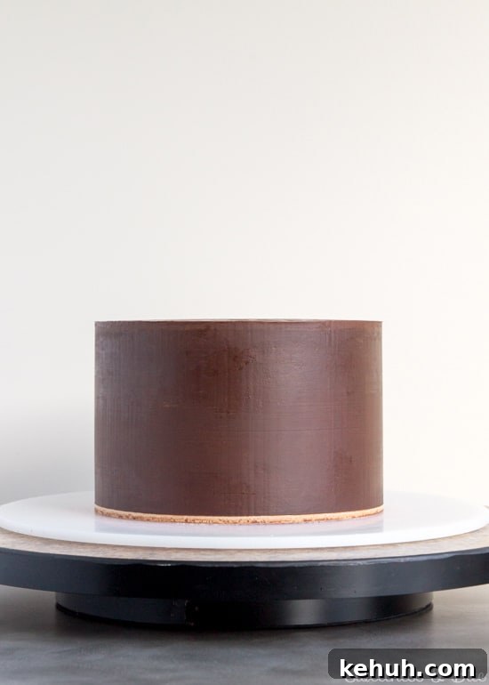 How to Cover a Cake with Smooth Ganache Finish 15 The finished ganached cake.