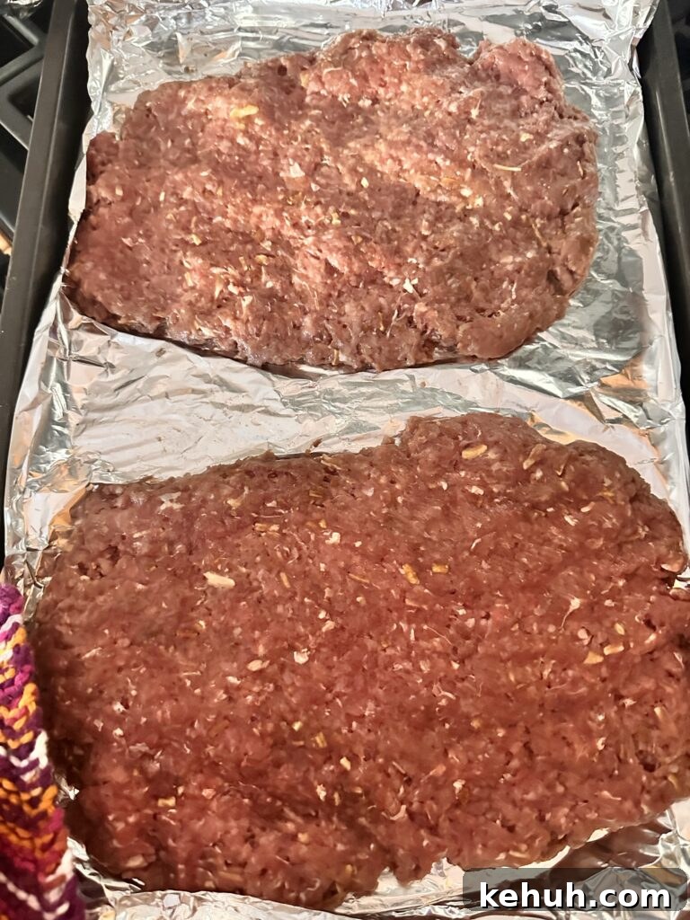 Copycat White Castle Sliders Recipe: Homemade Mini Beef Patties 3 Two patties of raw ground beef on foil
