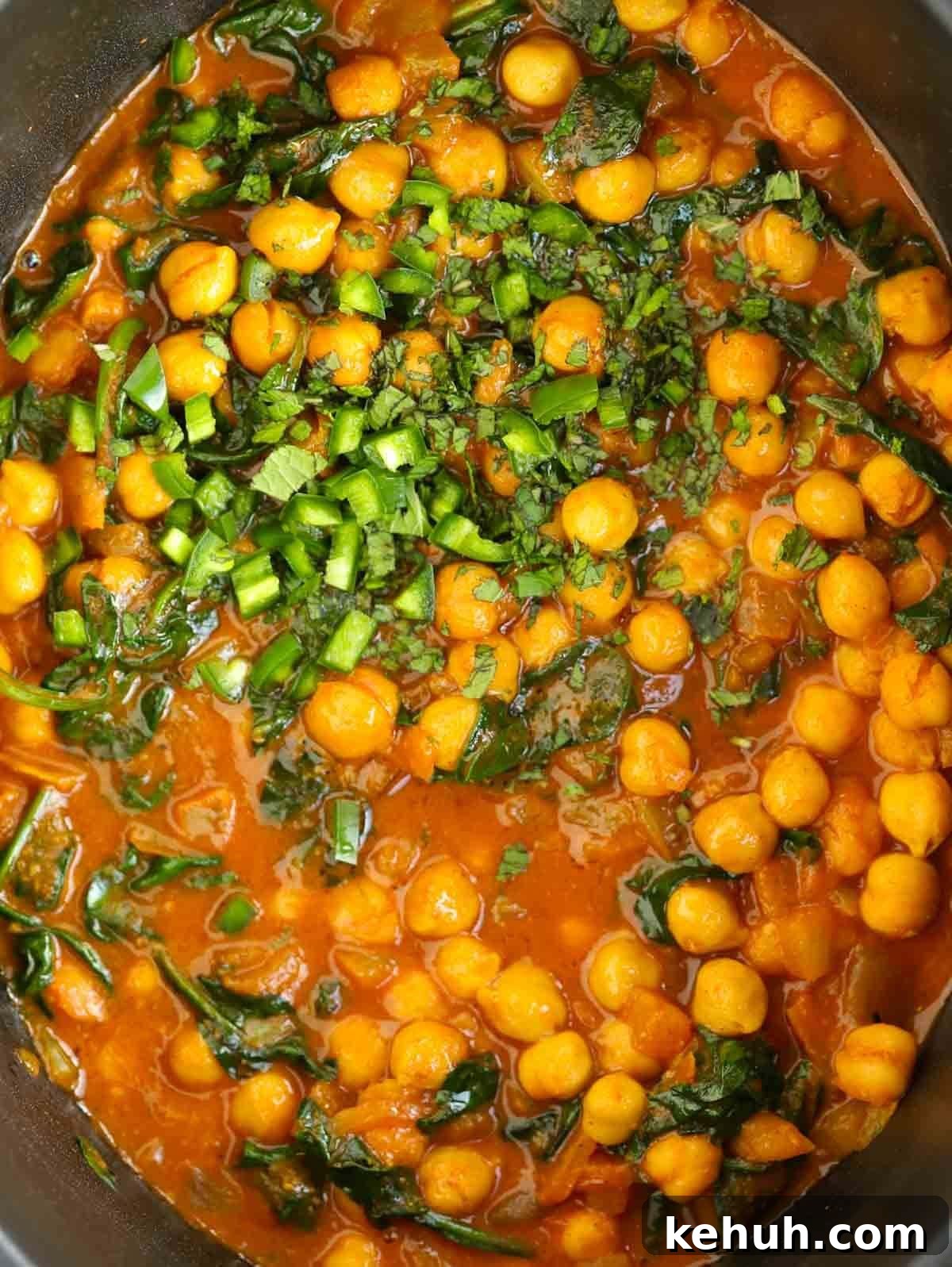 Close up of cooked curry with chickpeas.