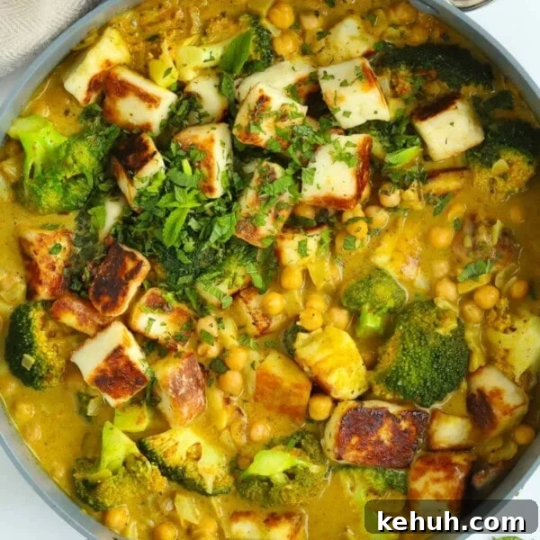 Pan full of delicious vegetarian curry made with halloumi, chickpeas and broccoli.