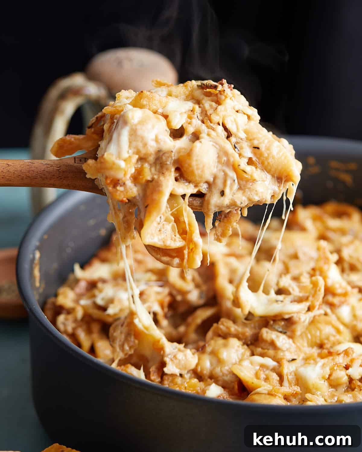 Up close image of french onion mac and cheese in black skillet.