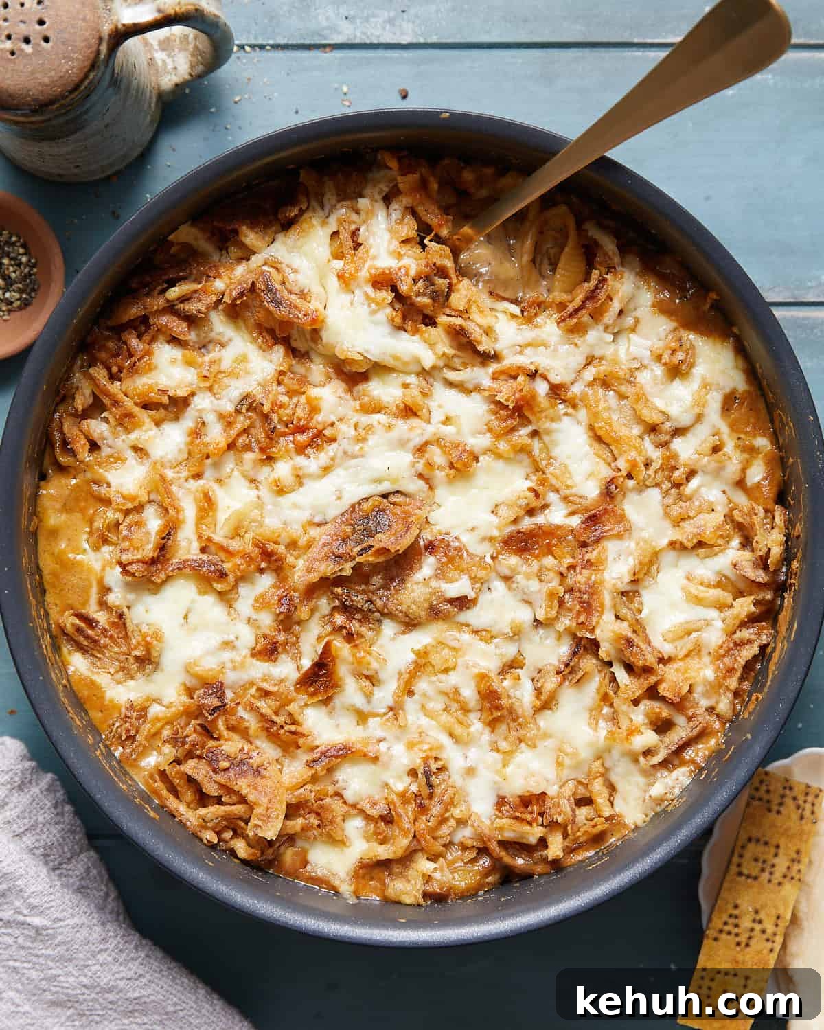 Overhead image of french onion mac and cheese in black skillet pan.