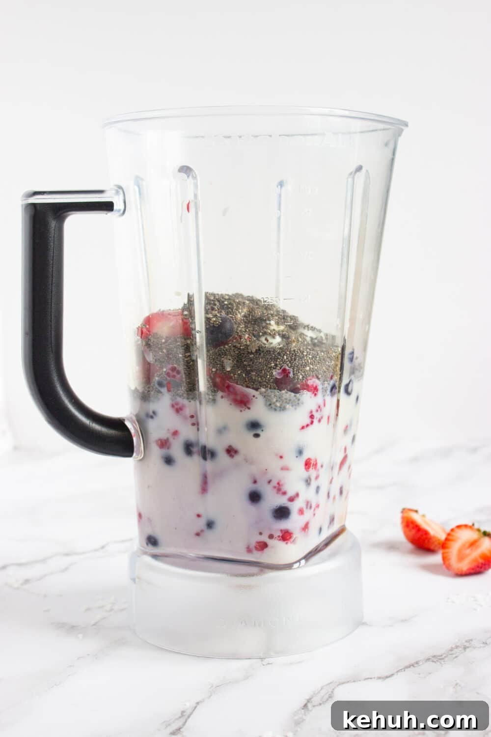 smoothie base ingredients in a blender ready to be blended