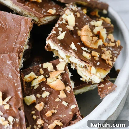 Classic Cracker Toffee Recipe with Crunchy Caramel Topping 11 Tray of nut covered saltine cracker toffee.