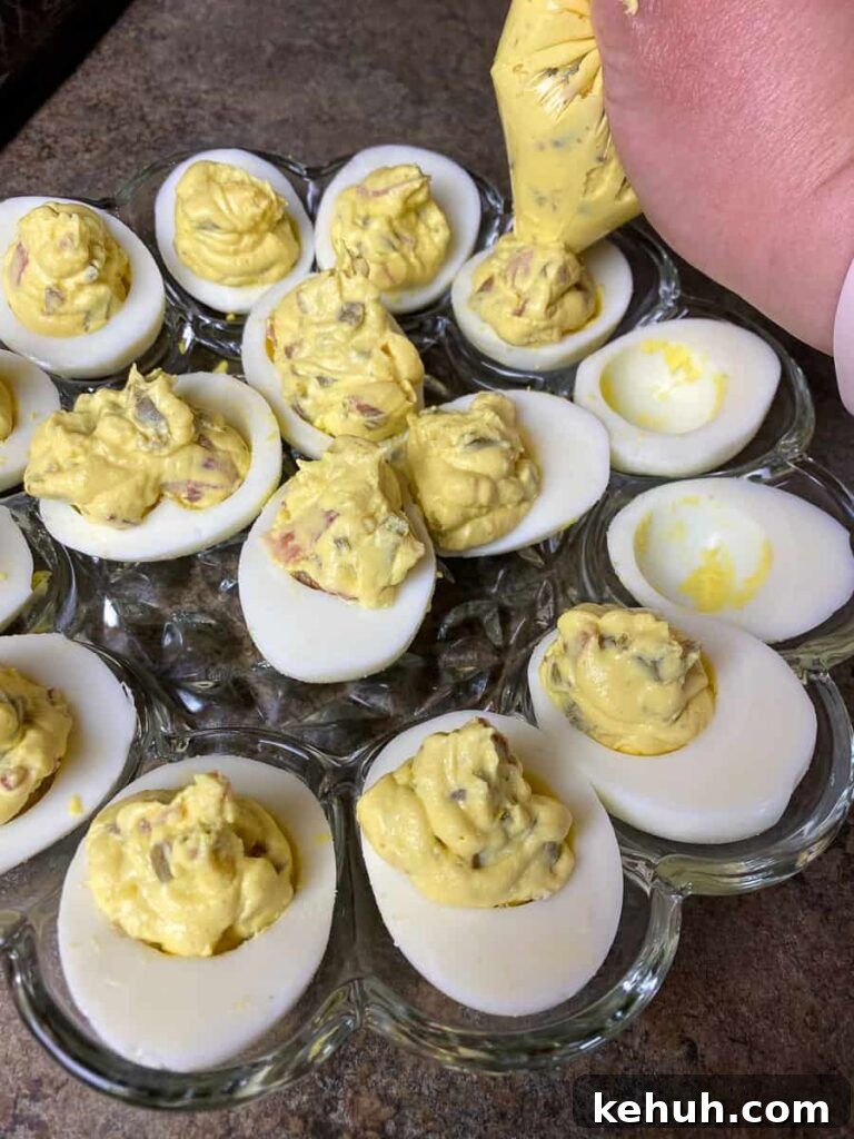 Bacon Jalapeño Deviled Eggs Recipe – Spicy Stuffed Egg Bites 8 Filling deviled eggs with a bag