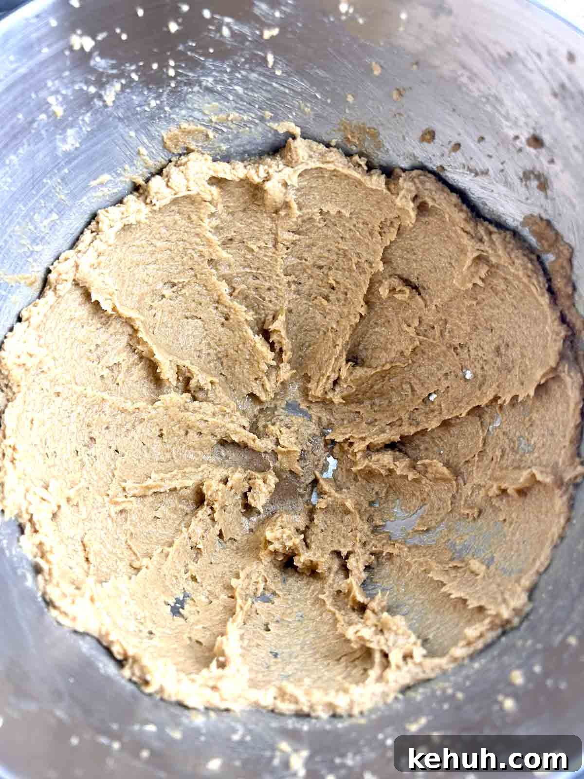 Classic Peanut Butter Blossom Cookies: Soft Chocolate Kiss Treats 5 butter being creamed with sugars in stand mixer.