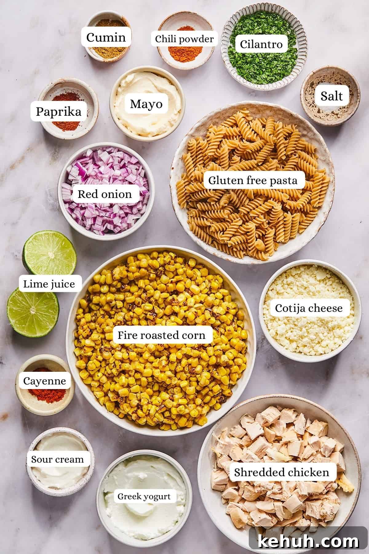 ingredients for street corn pasta salad in nesting bowls