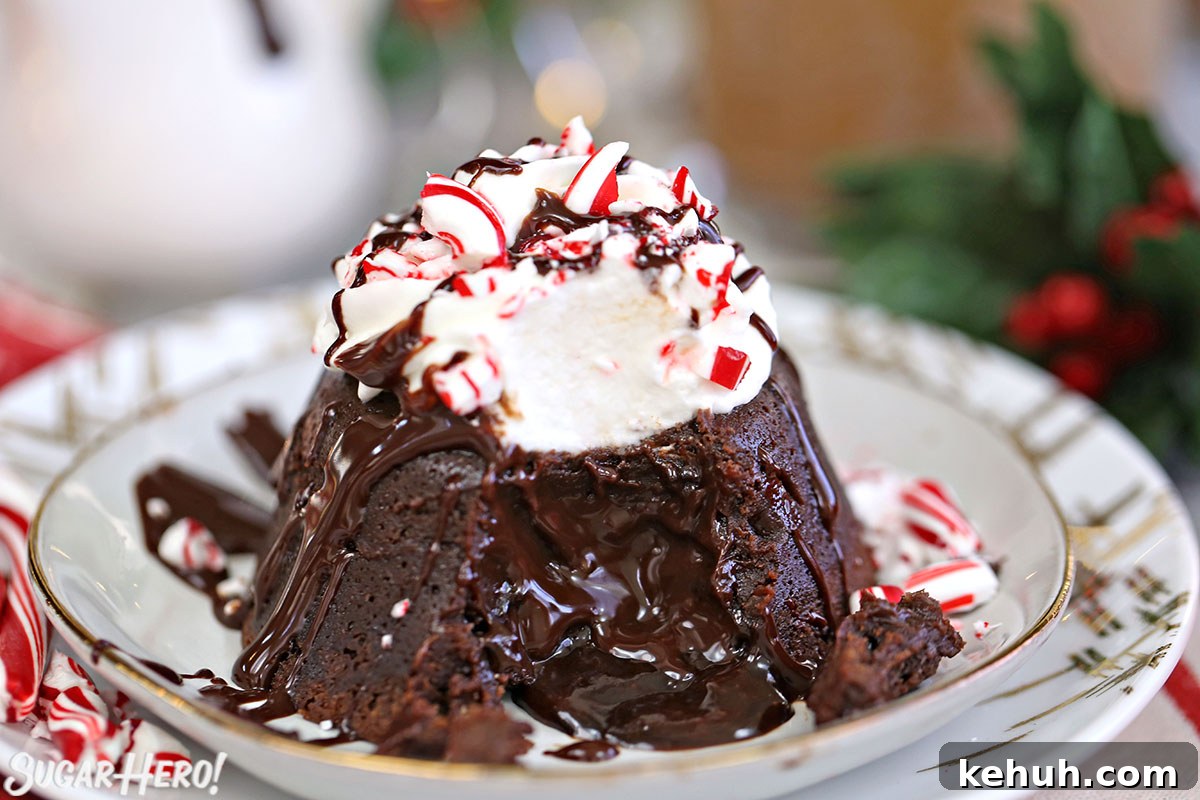 Close-up of Peppermint Lava Cake with a bite taken out of it and chocolate flowing from the center.