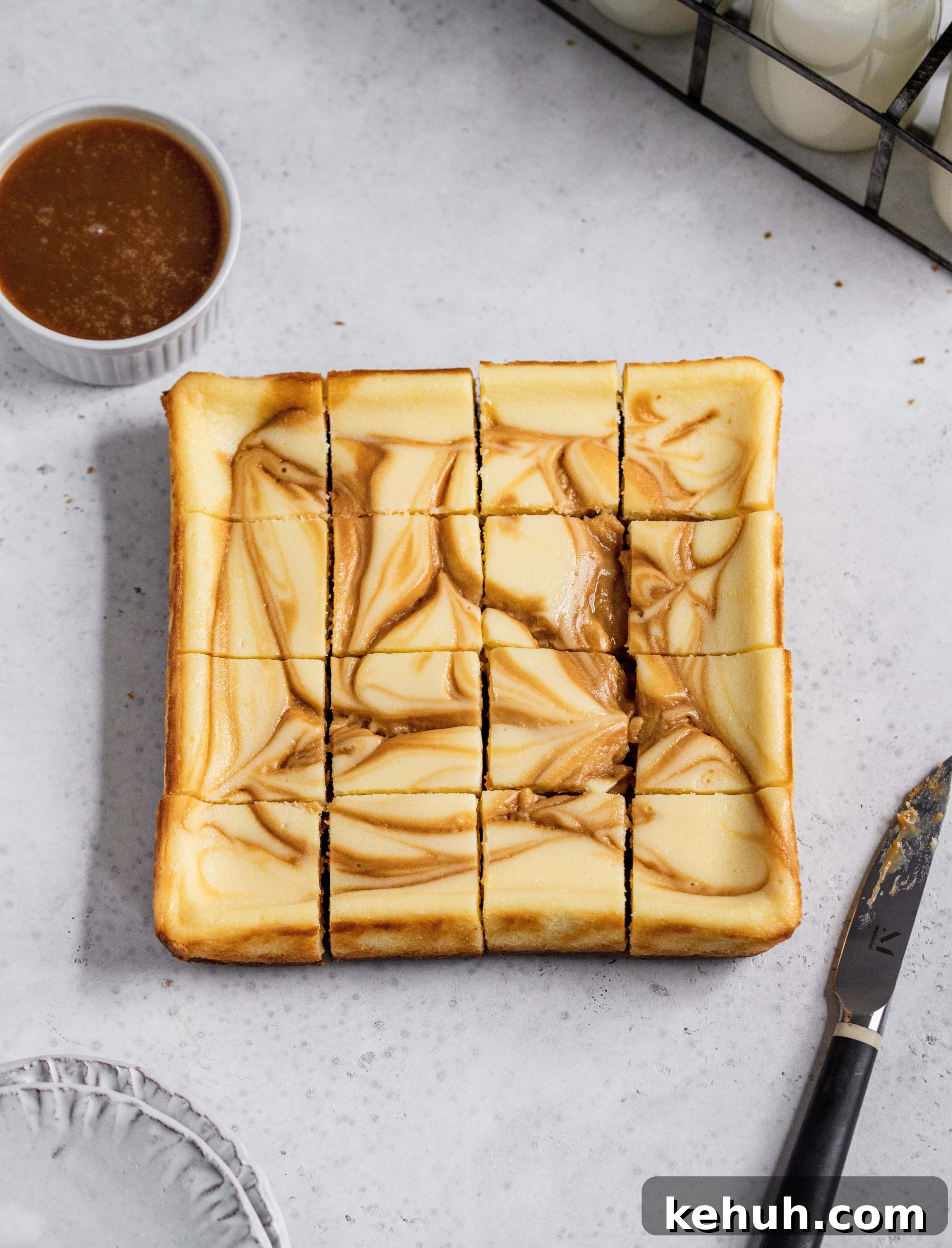 Salted Caramel Swirl Cheesecake Bars Recipe for Parties 6 Sliced salted caramel swirl cheesecake bars