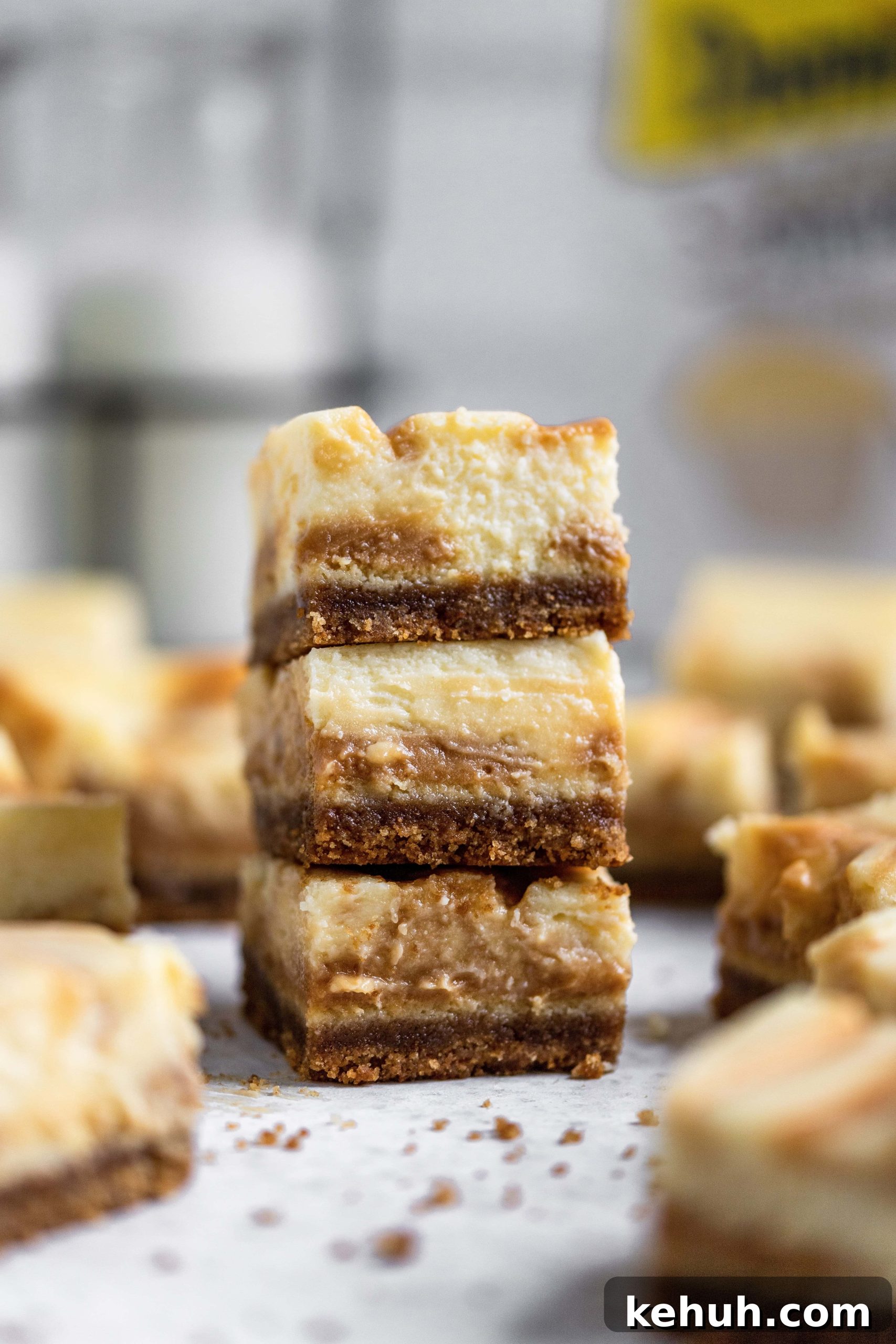 Salted Caramel Swirl Cheesecake Bars Recipe for Parties 9 Close up salted caramel cheesecake bars stacked