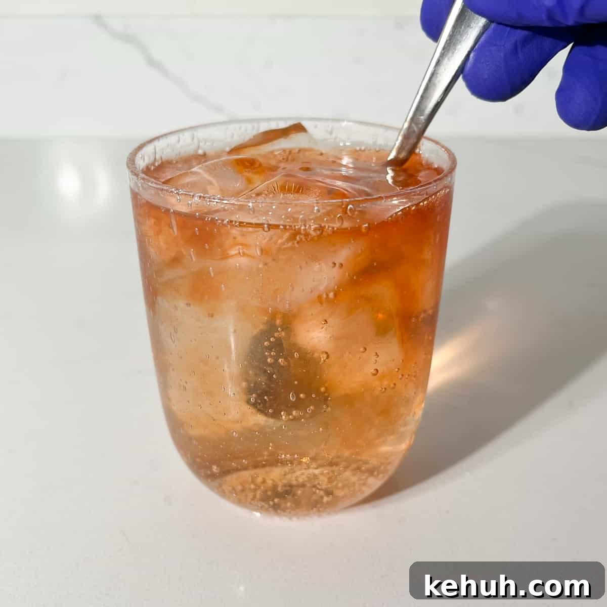 Classic Rock Shandy Recipe: Refreshing Lemon Beer Cocktail 7 Giving the rock shandy a stir with a spoon.