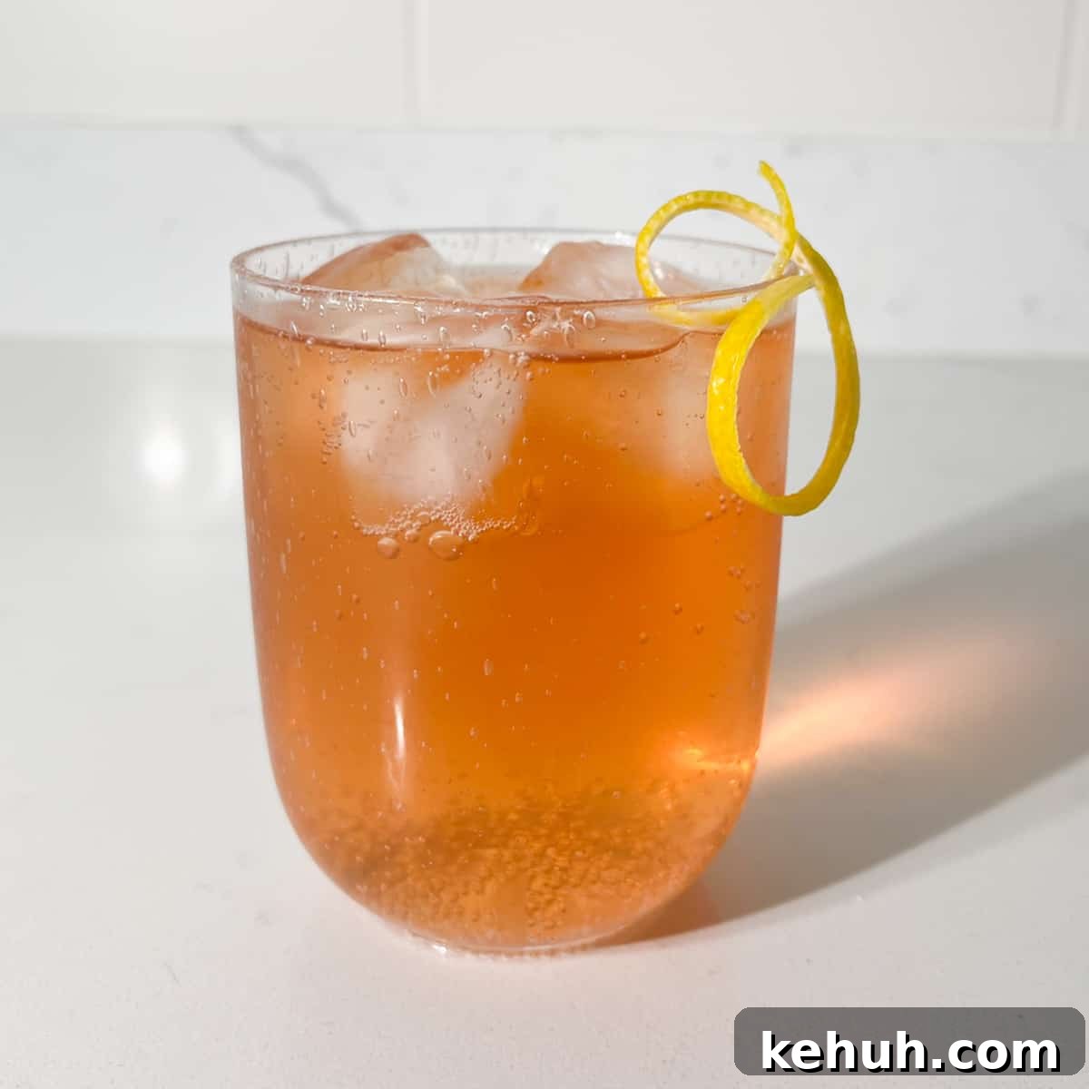 Classic Rock Shandy Recipe: Refreshing Lemon Beer Cocktail 8 A glass of completed rock shandy with a lemon peel twisty.