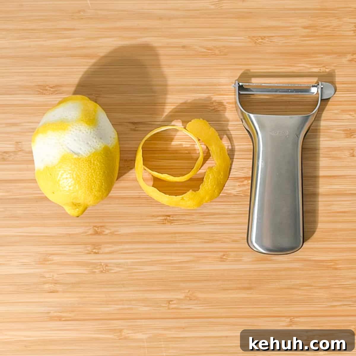 Classic Rock Shandy Recipe: Refreshing Lemon Beer Cocktail 9 Peeling a long length of lemon peel with a peeler.