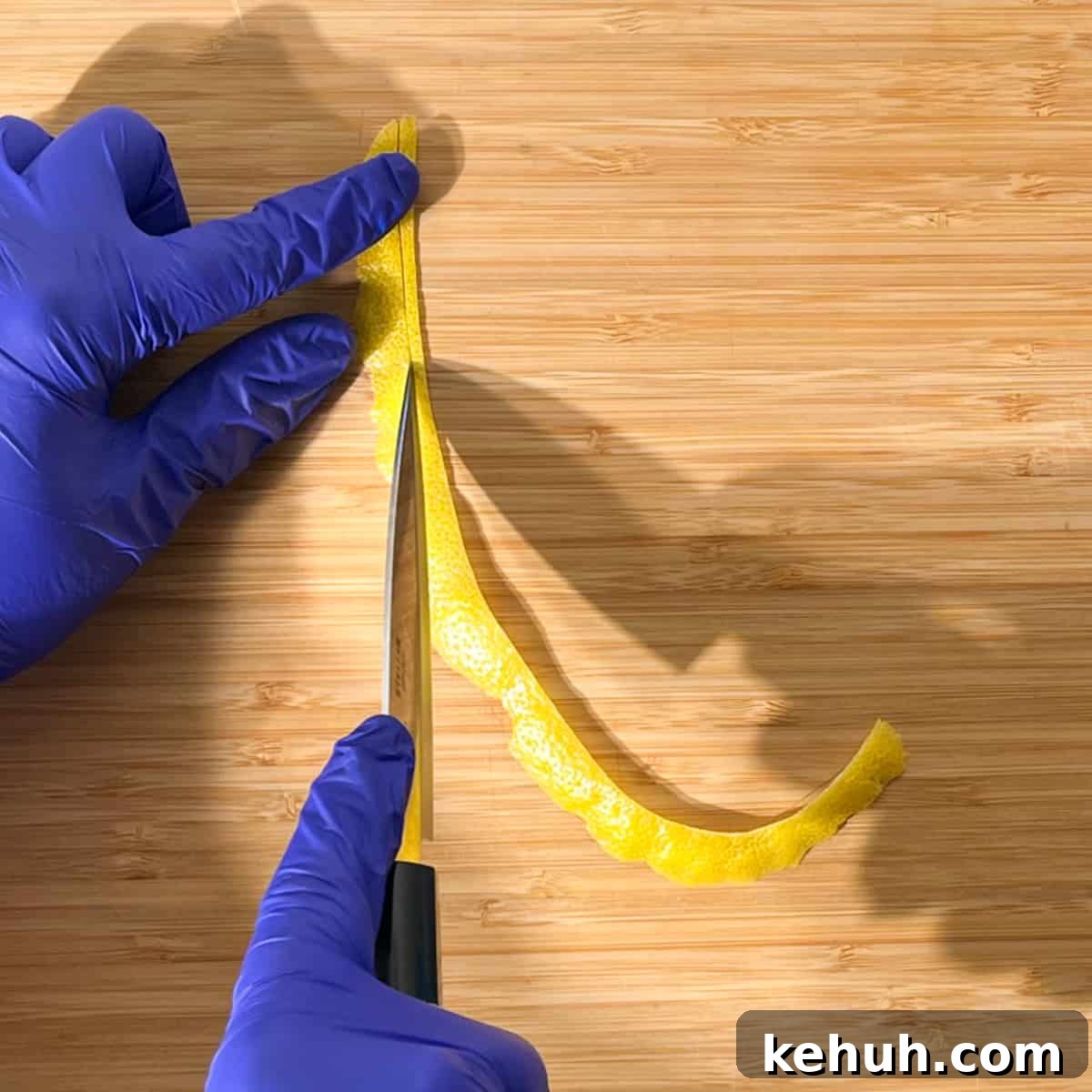 Classic Rock Shandy Recipe: Refreshing Lemon Beer Cocktail 10 Slicing a long strip of lemon peel for the lemon peel twisty to go on the rock shandy glass.