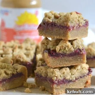 Sunbutter and Jelly Bars Recipe — No-Bake Snack Squares 9 Stack of Sunbutter and jelly bars