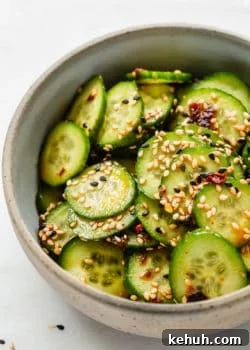 Asian cucumber salad topped with sesame seeds