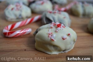 Peppermint Chocolate Christmas Cookies. Chocolate mint cookies with crushed candy canes and white chocolate chips. Dipped in white chocolate and topped with more candy canes! #candycanecookies #peppermintcookies #christmasbaking