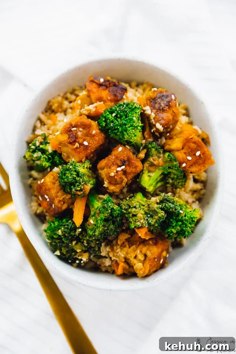 Overhead shot of tempeh stir fry with broccoli in a bowl. 