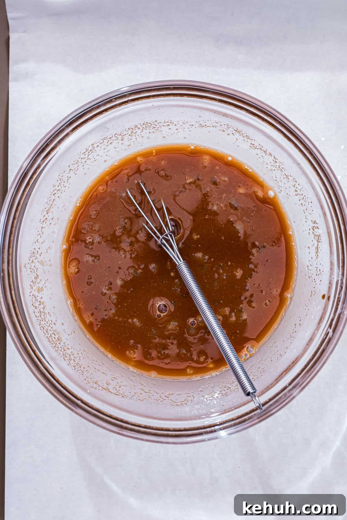Whisking teriyaki sauce ingredients in mixing bowl for Blackstone Teriyaki Chicken