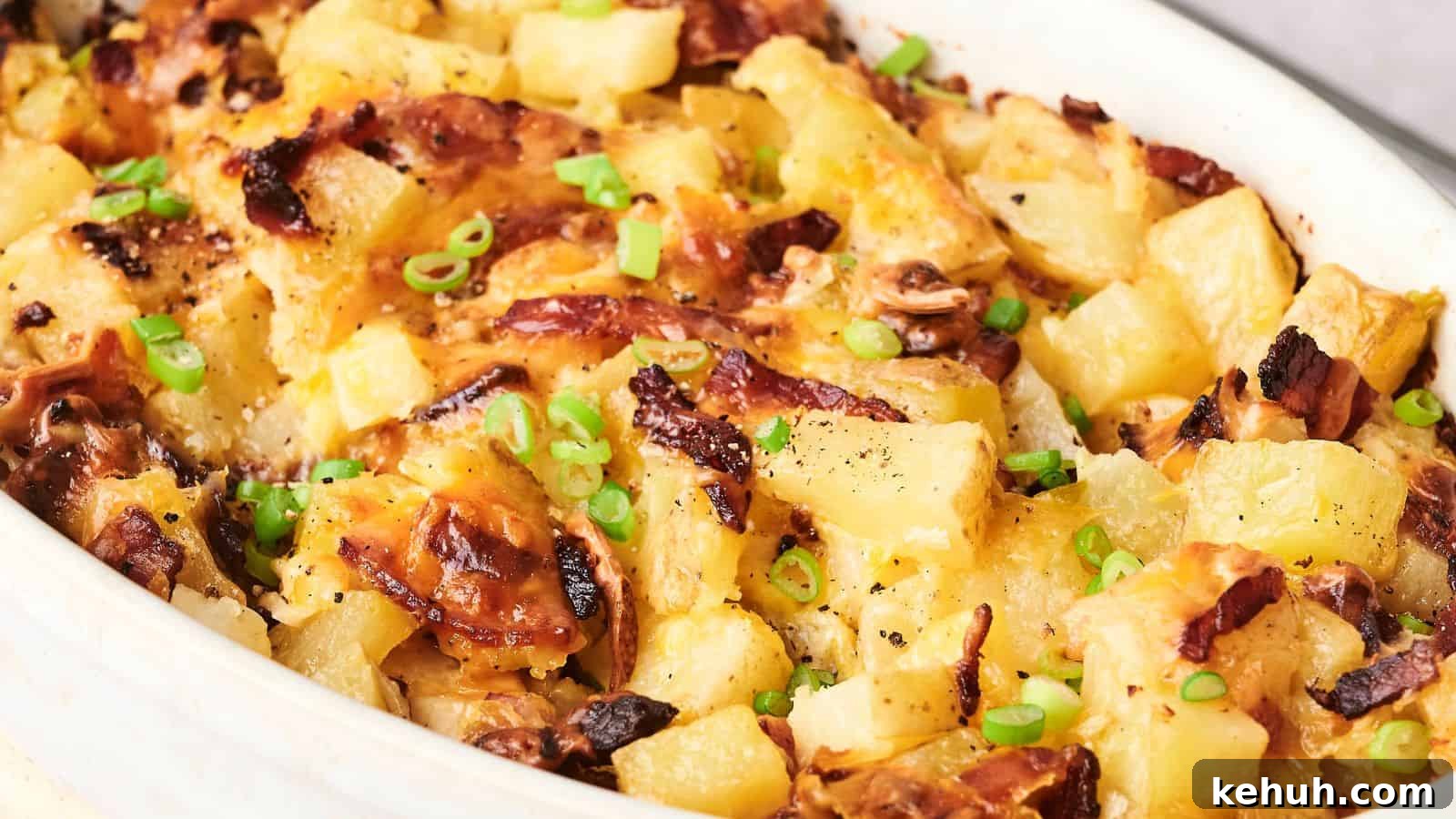 31 Homemade Thanksgiving Sides That Outshine Store-Bought 15 A baked dish with melted cheese, diced pineapples, browned bacon, and chopped green onions on top.