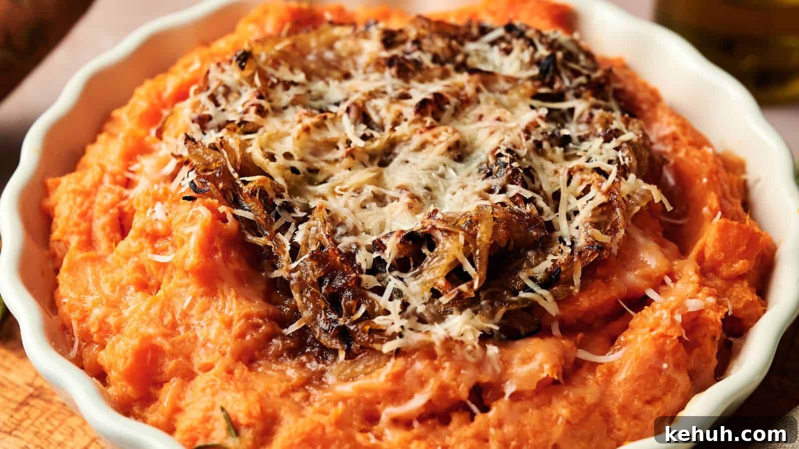 31 Homemade Thanksgiving Sides That Outshine Store-Bought 32 A bowl of mashed sweet potatoes topped with crispy caramelized onions and grated cheese.